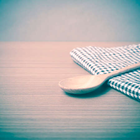wood spoon and kitchen towel on table vintage styleの写真素材