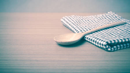 wood spoon and kitchen towel on table vintage styleの写真素材