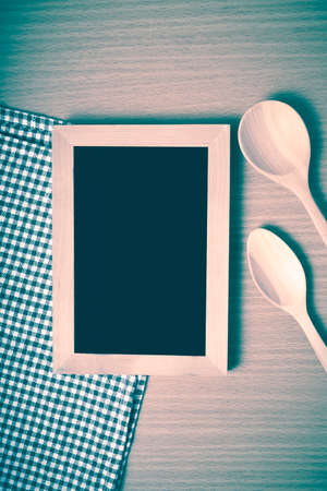 blackboard and wooden spoon on table vintage styleの写真素材