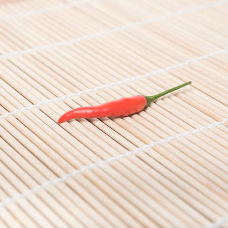 red chili peppers on matの写真素材
