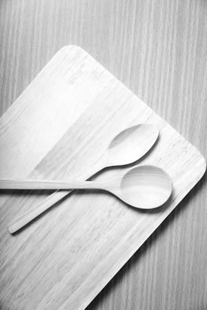 wood spoon with cutting board on table background  black and white color tone styleの写真素材