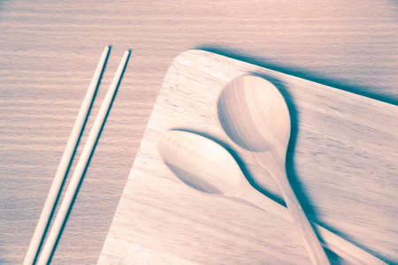 wood spoon with cutting board on table background vintage styleの写真素材