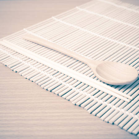 wood spoon and chopstick on mat vintage styleの写真素材