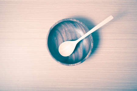 wood bowl and spoon on table background vintage styleの写真素材