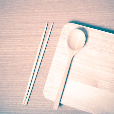 wood spoon with cutting board on table background vintage styleの写真素材