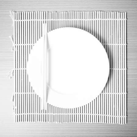 empty dish on mat black and white color tone styleの写真素材