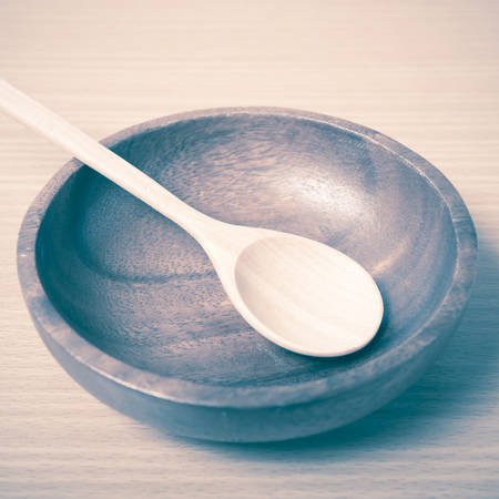 wood bowl and spoon on table background vintage styleの写真素材