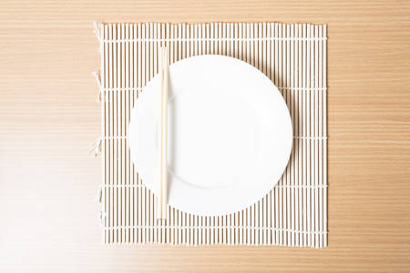 empty dish on matの写真素材
