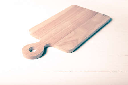 kitchen cutting board over white table background vintage style