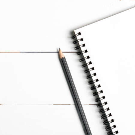 pencil and notepad on white table view from aboveの写真素材