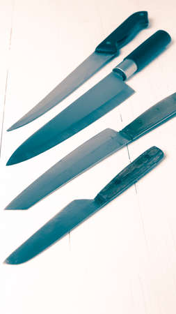 kitchen knife over table background vintage styleの写真素材