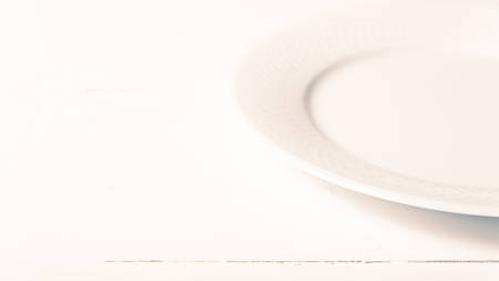 empty dish over white table background vintage styleの写真素材