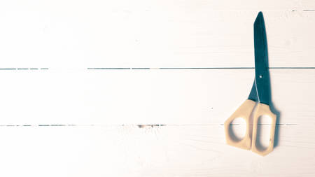 scissors over table background vintage styleの写真素材
