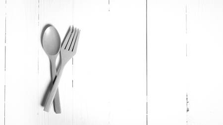 wood spoon and fork on black and white toneの写真素材