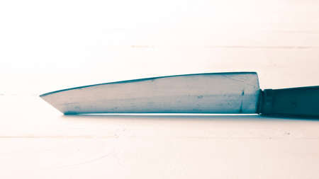 kitchen knife over table background vintage styleの写真素材