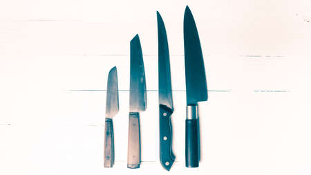 kitchen knife over table background vintage styleの写真素材