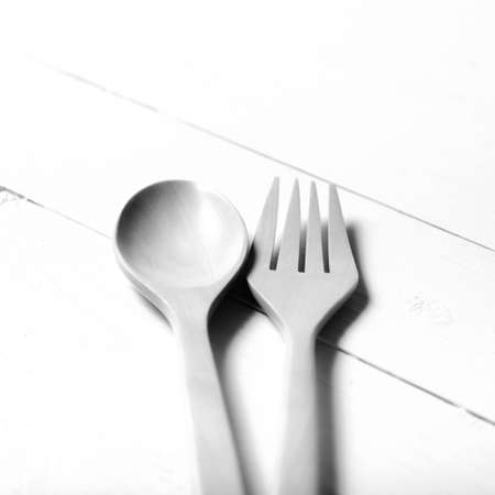 wood spoon and fork over table background black and white tone color styleの写真素材
