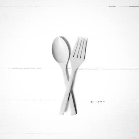 wood spoon and fork on black and white toneの写真素材