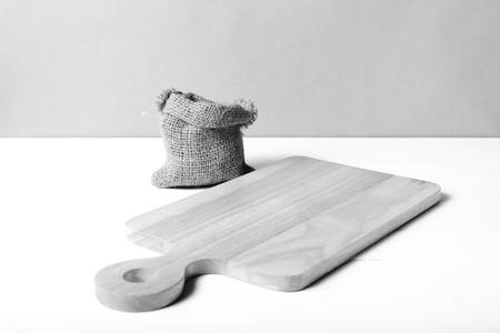 kitchen cutting board over white table background black and white tone color styleの写真素材