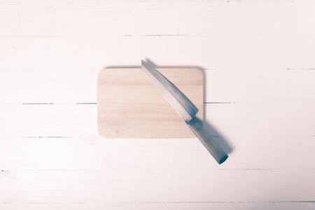 knife and cutting board on vintage styleの写真素材