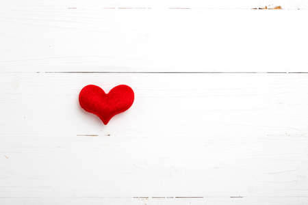 red heart on white table view from aboveの写真素材