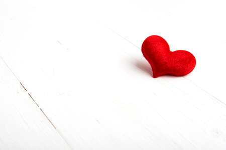 red heart on white tableの写真素材