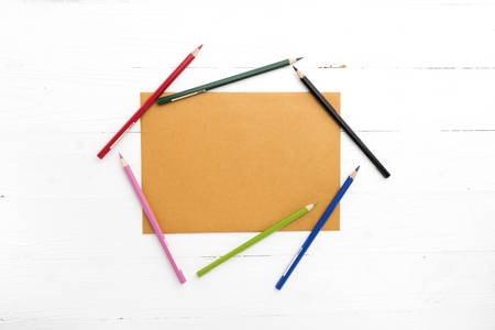 brown paper with color pencil on white tableの写真素材