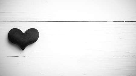 red heart on white table view from above black and white styleの写真素材