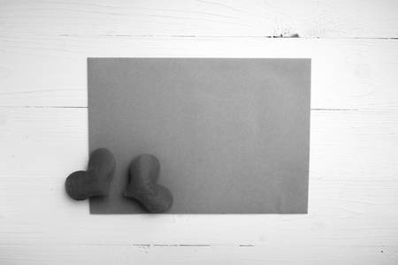 brown paper and heart on white table black and white tone color style