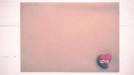 heart on brown paper over white table vintage styleの写真素材