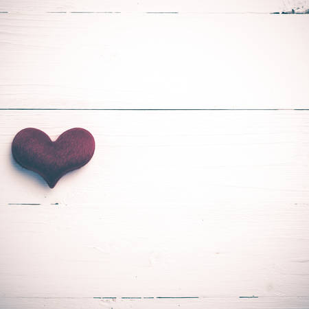 red heart on white table view from above vintage styleの写真素材