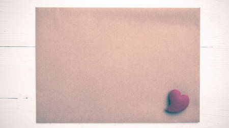heart on brown paper over white table vintage styleの写真素材