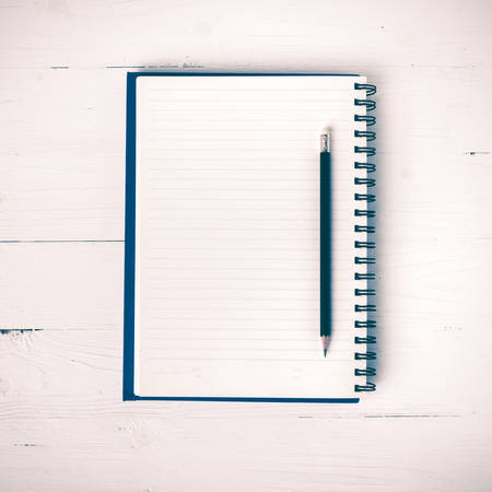 notepad with pen on white table vintage styleの写真素材