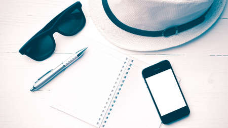 hat with summer tools over white table vintage styleの写真素材