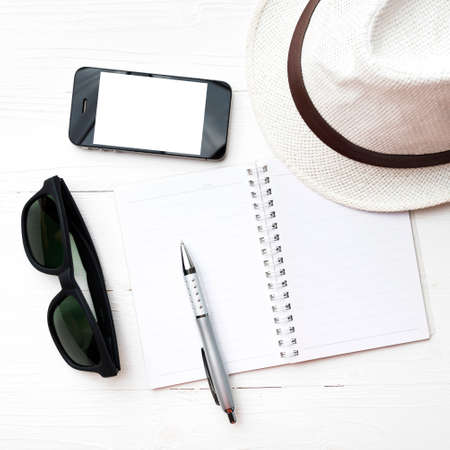 hat with summer tools over white tableの写真素材