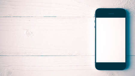 cellphone on white table vintage styleの写真素材