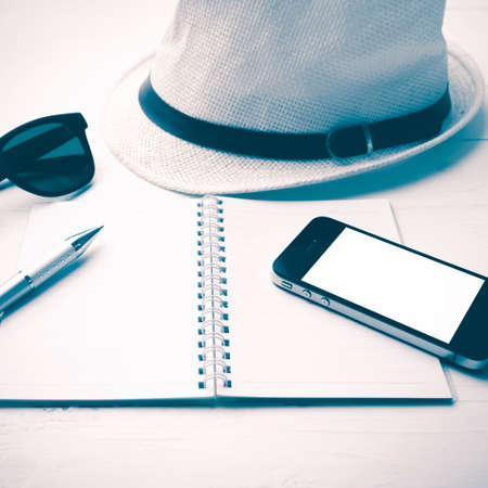 hat with summer tools over white table vintage styleの写真素材