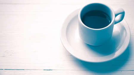 coffee cup over white table vintage styleの写真素材