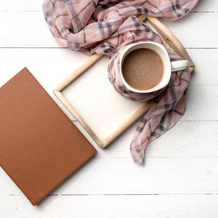 coffee and scarf background on white tableの写真素材