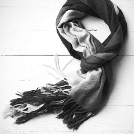 blue scarf over white wood table background black and white colorの写真素材