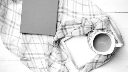 coffee and scarf background on white table black and white colorの写真素材