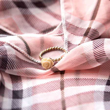 ring on scarf backgroundの写真素材