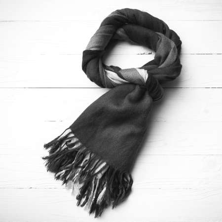 blue scarf over white wood table background black and white colorの写真素材