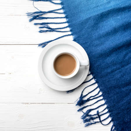 coffee and scarf background on white tableの写真素材