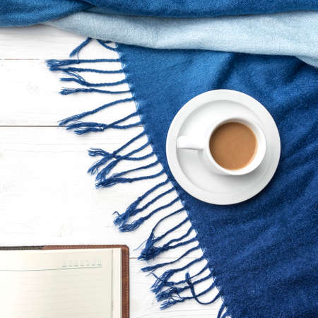 coffee and scarf background on white tableの写真素材