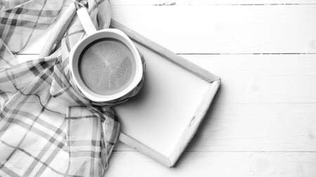 coffee and scarf background on white table black and white color