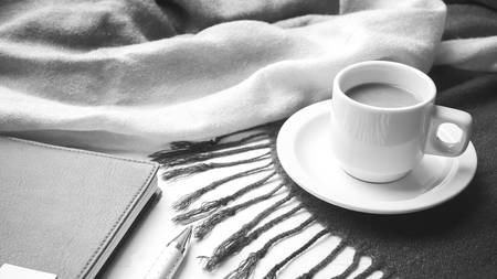 coffee and scarf background on white table black and white colorの写真素材