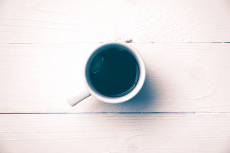 dirty coffee over white table vintage styleの写真素材