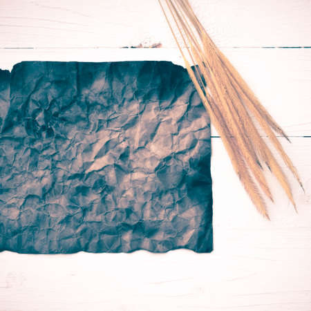 old brown paper and wheat on white table vintage style