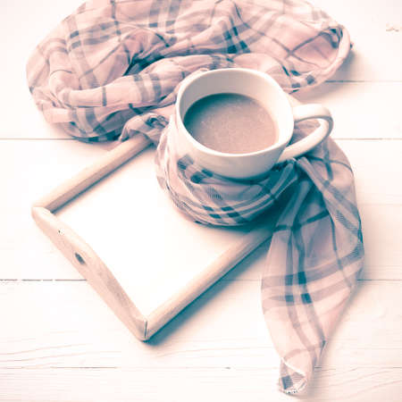 coffee and scarf background on white table vintage styleの写真素材
